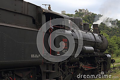 Old steam locomotive and background historic scenery Editorial Stock Photo